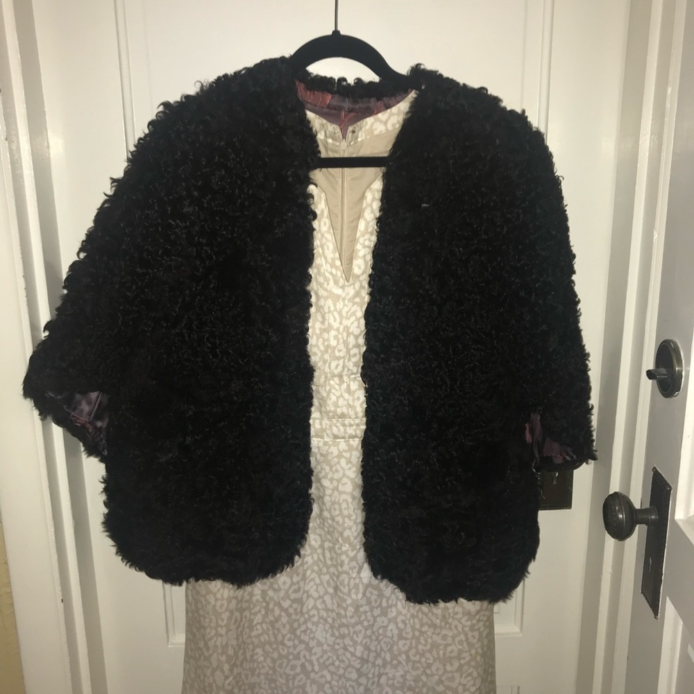 Fantastic vintage Tibetan wool cape! Silky floral lining, button loop closure.